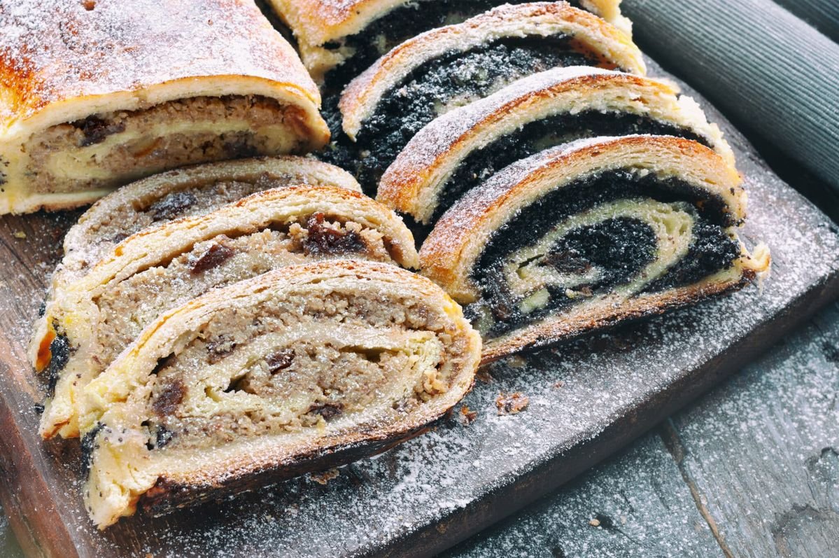 Walnut Roll (Diós Bejgli) Poppy seed roll and wallnut roll on wooden table
