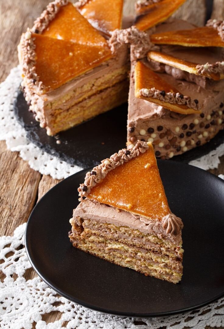 Delicatessen piece Hungarian Dobosh cake with caramel close-up.